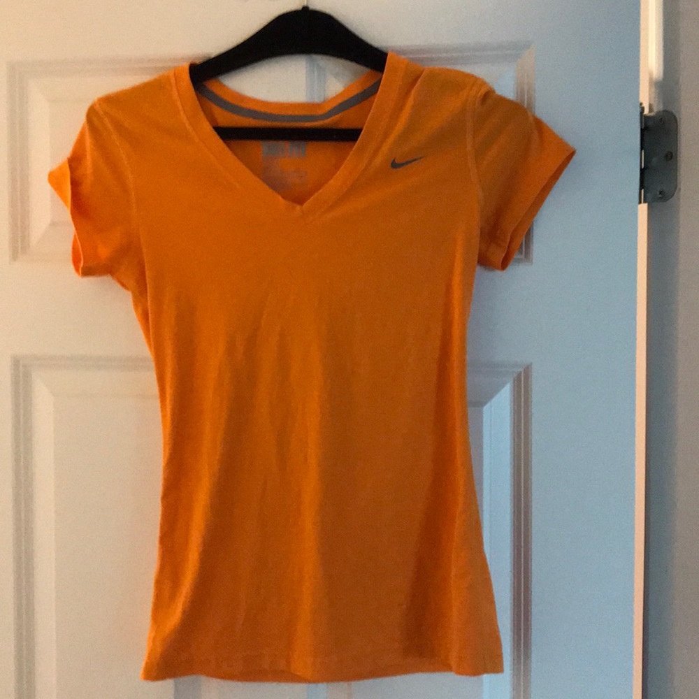 Orange Nike Dri-Fit shirt